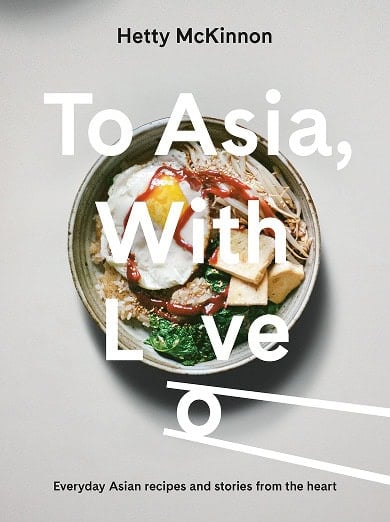 Cover of the cookbook "To Asia, With Love" by Hetty McKinnon, featuring a bowl of rice with an egg, vegetables, and sauce, with chopsticks and large white text overlaid.